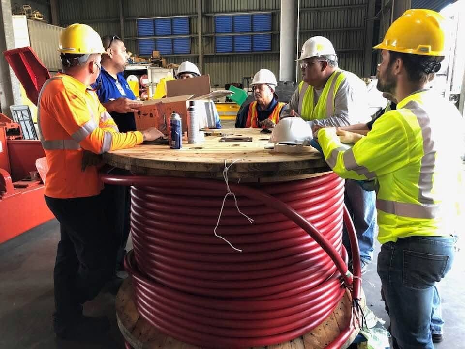 Technical personnel wearing protective equipment at an industrial location
